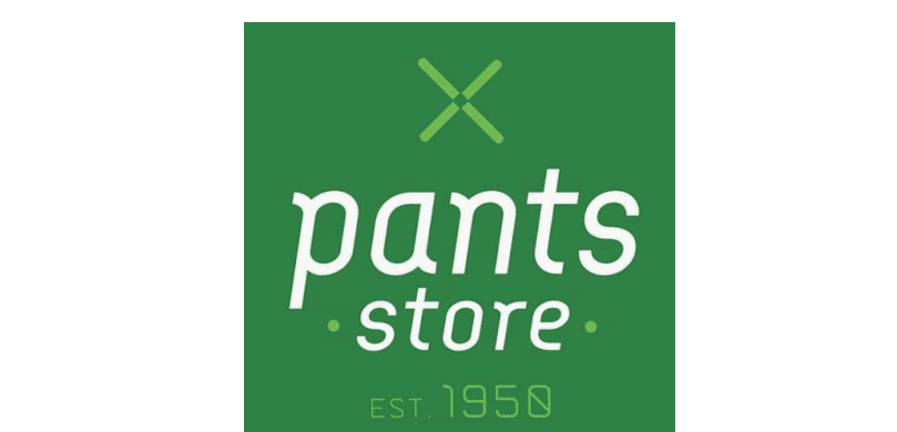 The word “pants" is written in white lowercase letters on a green background with a stylized green "X" above it. Description generated by AI