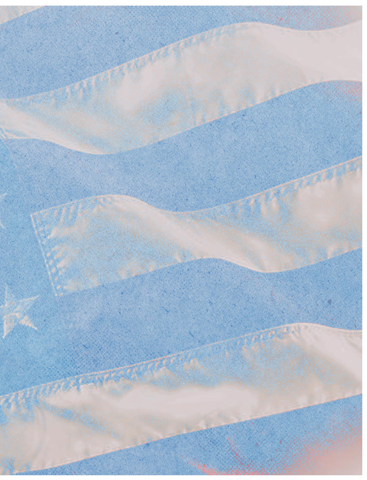 A close-up view of a fabric with light blue and white stripes and a white star on the blue section. Description generated by AI