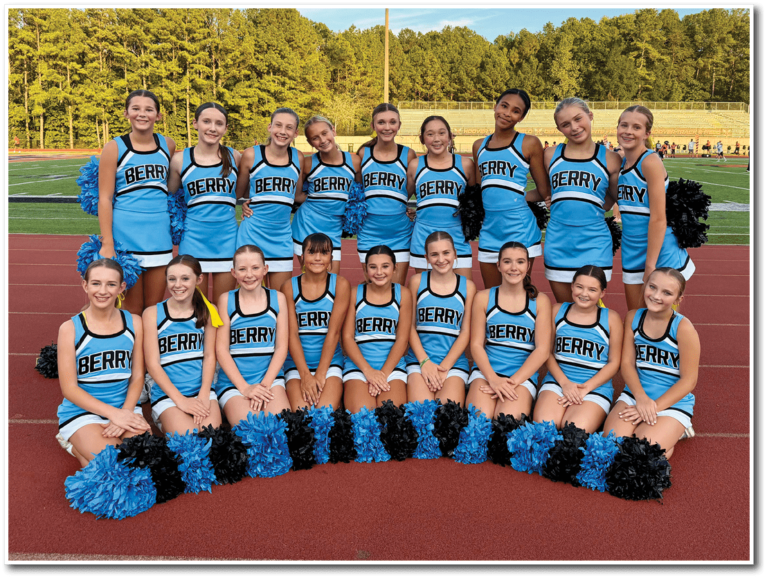 A group of people wearing blue cheerleading uniforms with the word “BERRY" on them are posing together outdoors on a sports field with trees in the background. Description generated by AI