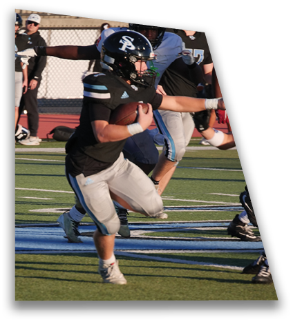Two people wearing athletic clothing and cleats are running on a football field with a blue and white logo visible on the turf. Description generated by AI