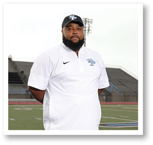 A man wearing a white shirt and a black hat stands on a football field. AI generated content