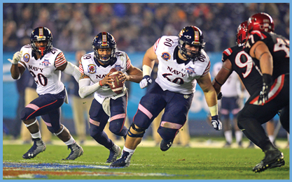 Two football players from opposing teams are running on the field. One player is holding a football and the other is wearing a pink jersey. AI generated content