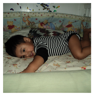 A young child is lying on a bed with a Winnie the Pooh blanket. AI generated content