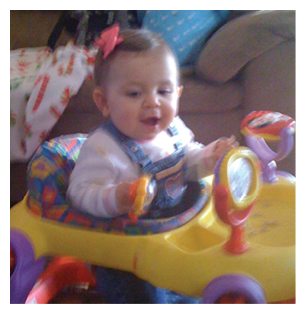 A baby girl is sitting in a toy car, smiling and playing. AI generated content