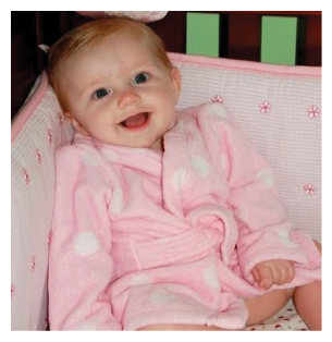 A baby wearing a pink robe is sitting in a crib. AI generated content