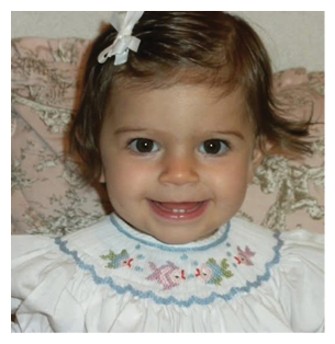 A young girl is smiling and wearing a white dress with a blue collar. AI generated content