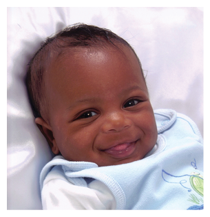 A baby is laying on a white sheet, smiling and looking at the camera. AI generated content