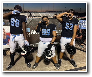 Three football players pose for a picture on the field. AI generated content