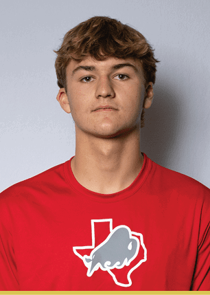 A young man wearing a white and black jersey with the number 14 on it. Description generated by AI