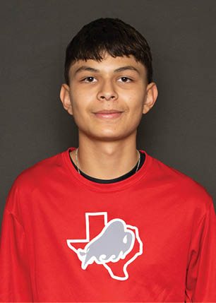 A young man wearing a white and black jersey with the number 14 on it. Description generated by AI