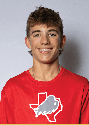 A young man wearing a white and black jersey with the number 14 on it. Description generated by AI