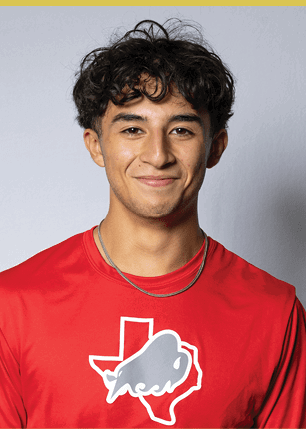 A young man wearing a white and black jersey with the number 14 on it. Description generated by AI