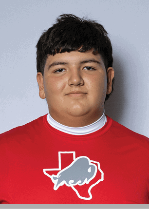 A young man wearing a white and black jersey with the number 14 on it. Description generated by AI