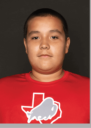 A young man wearing a white and black jersey with the number 14 on it. Description generated by AI