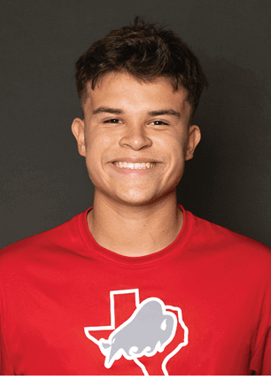 A young man wearing a white and black jersey with the number 14 on it. Description generated by AI