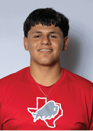 A young man wearing a white and black jersey with the number 14 on it. Description generated by AI