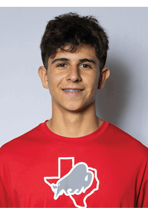 A young man wearing a white and black jersey with the number 14 on it. Description generated by AI