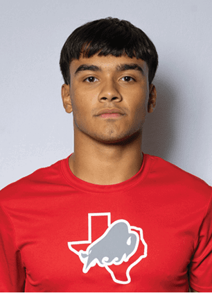 A young man wearing a white and black jersey with the number 14 on it. Description generated by AI