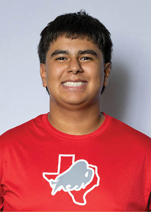 A young man wearing a white and black jersey with the number 14 on it. Description generated by AI