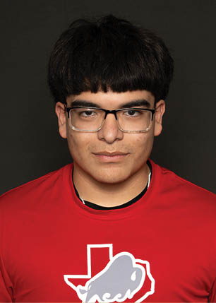 A young man wearing a white and black jersey with the number 14 on it. Description generated by AI