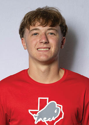 A young man wearing a white and black jersey with the number 14 on it. Description generated by AI