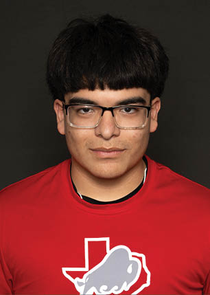 A young man wearing a white and black jersey with the number 14 on it. Description generated by AI