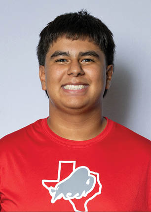 A young man wearing a white and black jersey with the number 14 on it. Description generated by AI