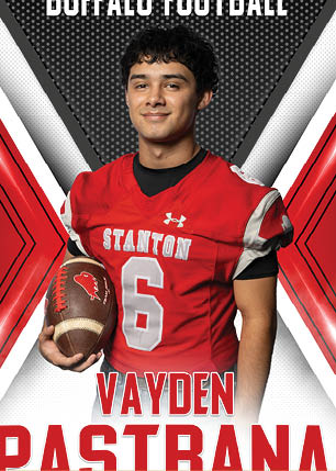 A young man wearing a white and black jersey with the number 14 on it. Description generated by AI