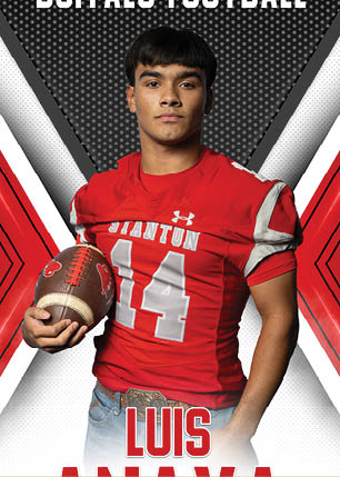 A young man wearing a white and black jersey with the number 14 on it. Description generated by AI