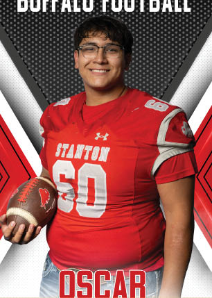 A young man wearing a white and black jersey with the number 14 on it. Description generated by AI