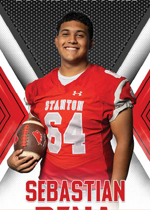 A young man wearing a white and black jersey with the number 14 on it. Description generated by AI