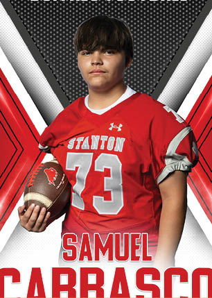 A young man wearing a white and black jersey with the number 14 on it. Description generated by AI