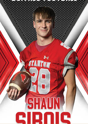A young man wearing a white and black jersey with the number 14 on it. Description generated by AI