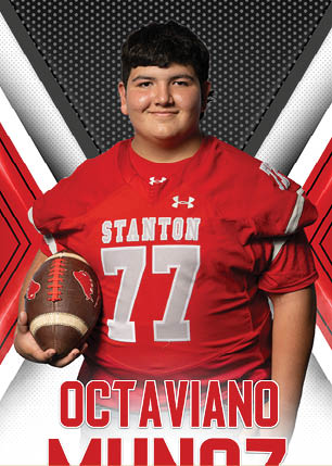 A young man wearing a white and black jersey with the number 14 on it. Description generated by AI