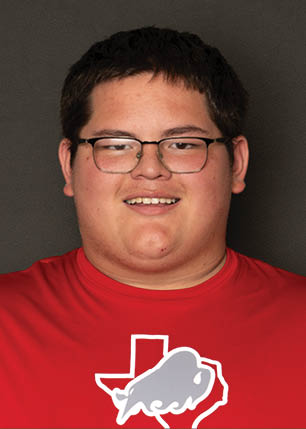 A young man wearing a white and black jersey with the number 14 on it. Description generated by AI