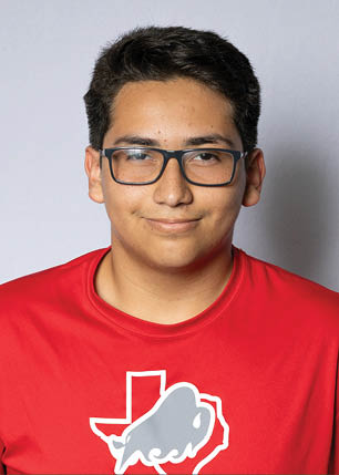 A young man wearing a white and black jersey with the number 14 on it. Description generated by AI
