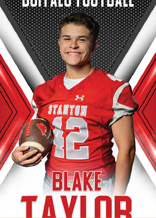 A young man wearing a white and black jersey with the number 14 on it. Description generated by AI