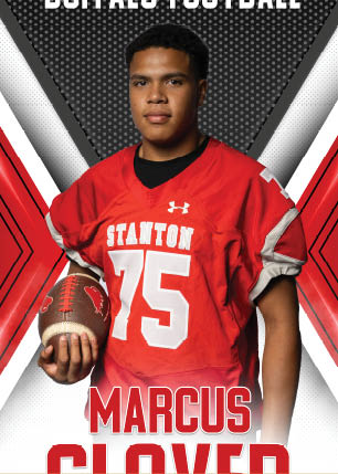 A young man wearing a white and black jersey with the number 14 on it. Description generated by AI