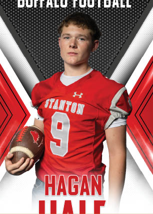 A young man wearing a white and black jersey with the number 14 on it. Description generated by AI