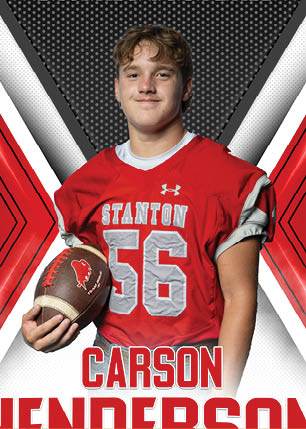 A young man wearing a white and black jersey with the number 14 on it. Description generated by AI