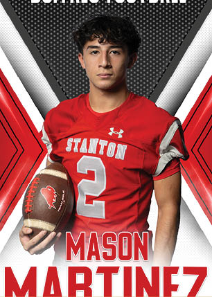 A young man wearing a white and black jersey with the number 14 on it. Description generated by AI