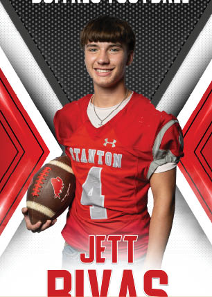 A young man wearing a white and black jersey with the number 14 on it. Description generated by AI