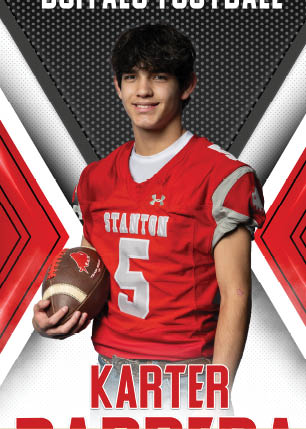 A young man wearing a white and black jersey with the number 14 on it. Description generated by AI