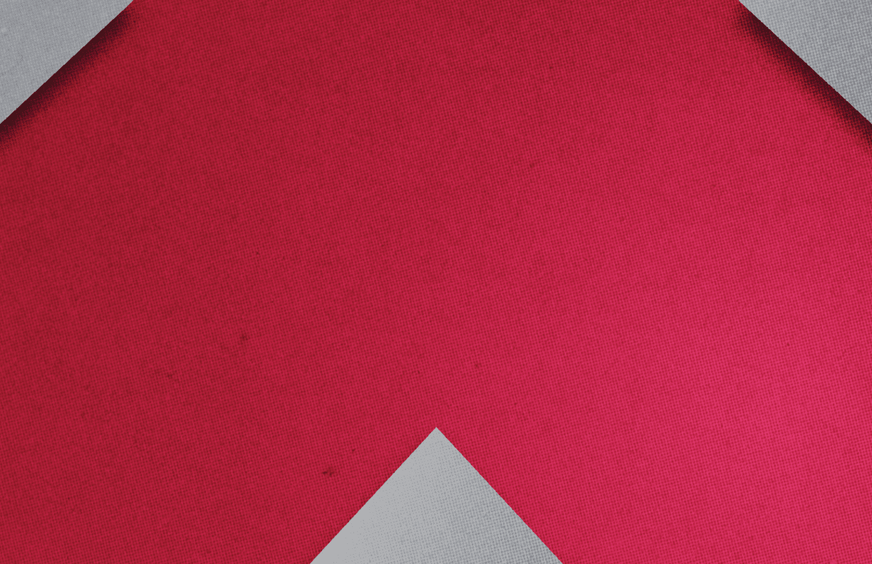 A red and gray cloth with a triangle shape. Description generated by AI