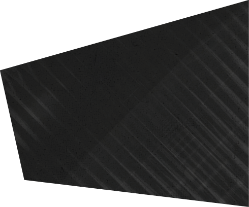 A dark trapezoidal shape with diagonal striped patterns and a subtle shadow on a white background. Description generated by AI