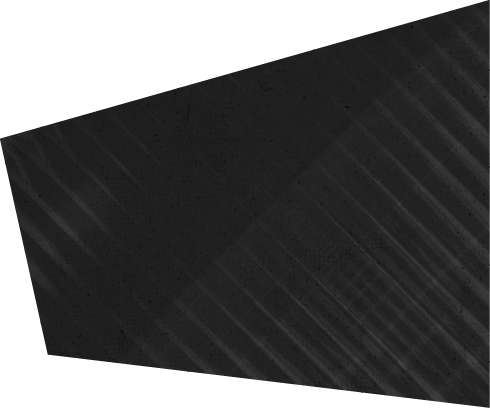 A dark trapezoidal shape with diagonal striped patterns and a subtle shadow on a white background. Description generated by AI