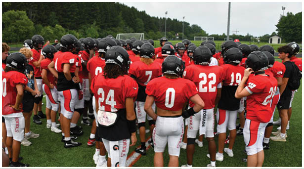 A football game is being played on a field. Description generated by AI