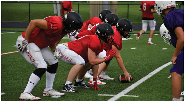 A football game is being played on a field. Description generated by AI