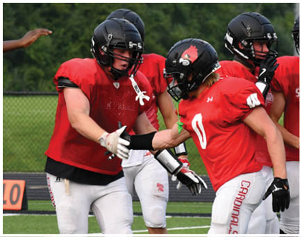 A football game is being played on a field. Description generated by AI