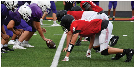 A football game is being played on a field. Description generated by AI